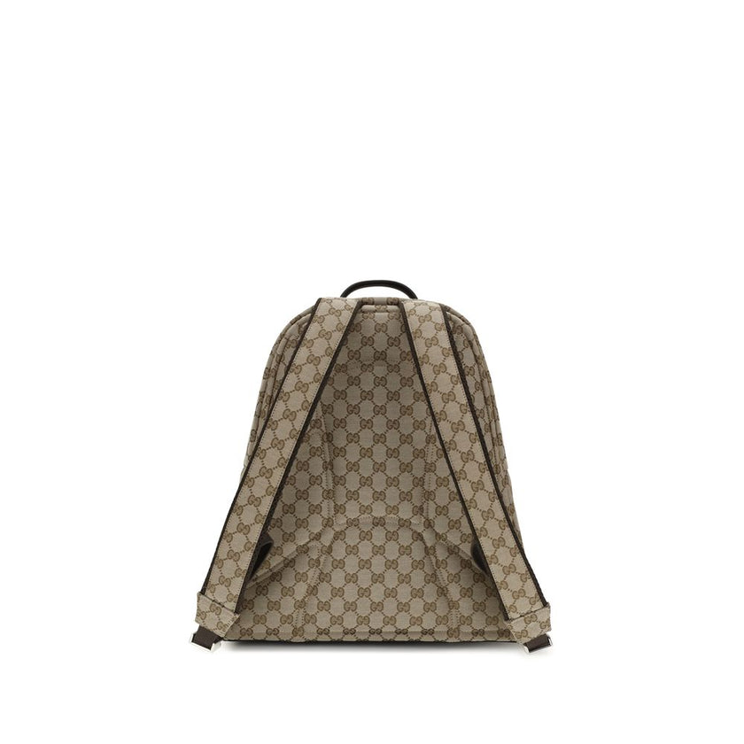 Beige Nylon BackpackThe GG Fabric Backpack by Gucci, from the Spring Summer 2025 Collection, combines craftsmanship and functionality in an elegant design. Crafted in beige and dark brown GG fabric with leather trims and a cotton-linen lining, it features