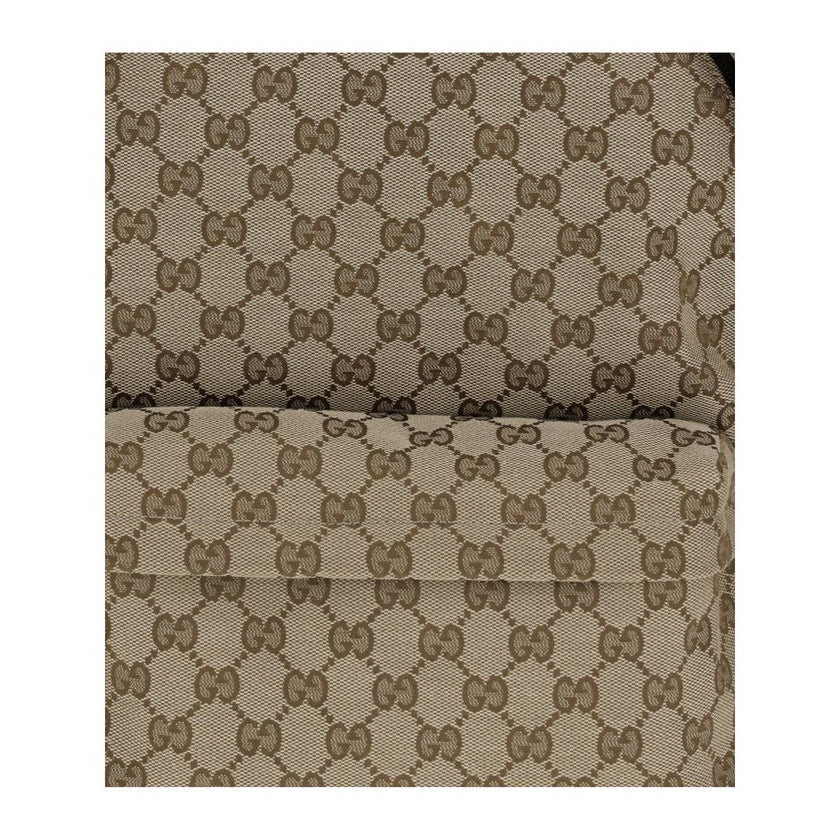 Beige Nylon BackpackThe GG Fabric Backpack by Gucci, from the Spring Summer 2025 Collection, combines craftsmanship and functionality in an elegant design. Crafted in beige and dark brown GG fabric with leather trims and a cotton-linen lining, it features