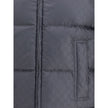 Black Wool Sleveless JacketThe Reversible Bouclé Wool Gilet by Gucci fuses practicality with contemporary elegance. One side showcases the rich texture of black bouclé wool, while the other reveals nylon detailed with the iconic GG motif, offering two dis