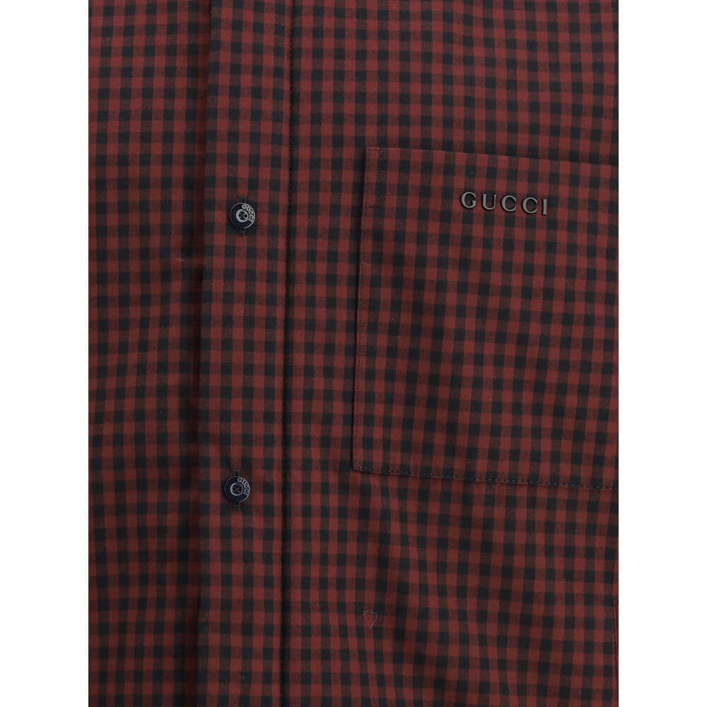 Bordeaux Cotton ClothingThe Checked Cotton Jacket by Gucci reimagines the timeless charm of classic patterns with a contemporary edge. Embellished with a refined Gucci embroidery, it features a quilted lining for added comfort and structure. A pointed col