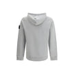 Gray Cotton SweatshirtThe Hoodie by Stone Island combines functionality and iconic style. Featuring an adjustable drawstring hood, it has a regular fit and two practical side welt pockets. The ribbed cuffs and straight hem ensure comfort and a snug fit, w