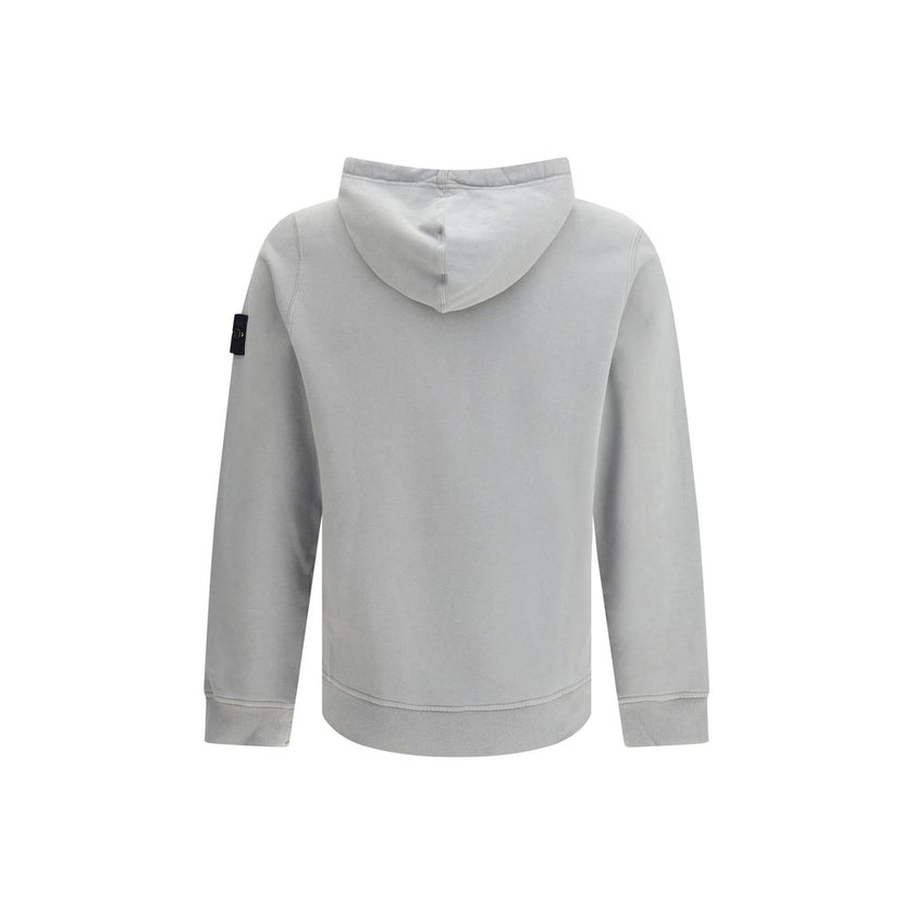 Gray Cotton SweatshirtThe Hoodie by Stone Island combines functionality and iconic style. Featuring an adjustable drawstring hood, it has a regular fit and two practical side welt pockets. The ribbed cuffs and straight hem ensure comfort and a snug fit, w