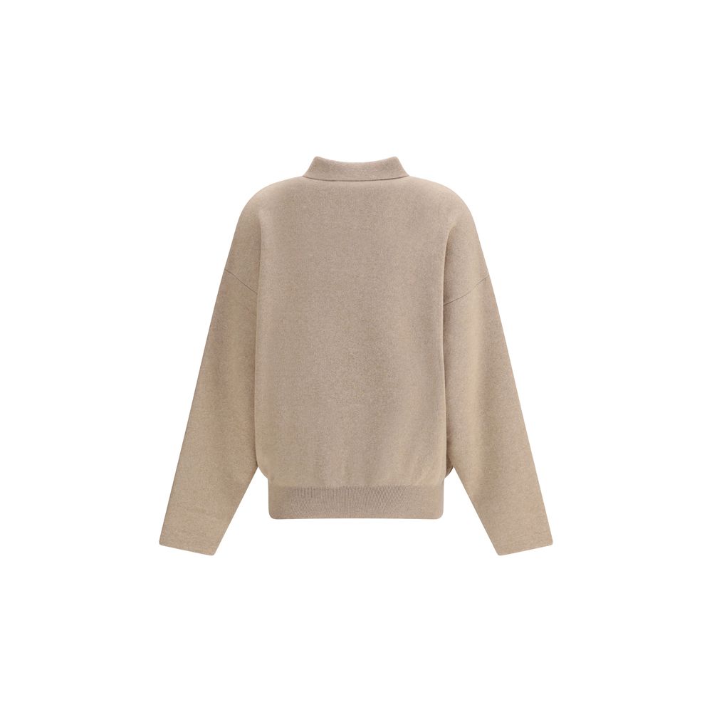 Beige Wool SweatshirtThis relaxed-fit Polo Sweater is crafted from heavy virgin Wool and Cashmere, perfect for colder days. Featuring a wide turtleneck, ribbed collar, cuffs and hem, and a yoke panel, it is finished with a red embroidered ‘J’ on the colla