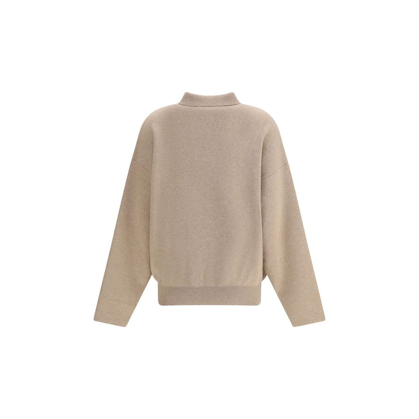 Beige Wool SweatshirtThis relaxed-fit Polo Sweater is crafted from heavy virgin Wool and Cashmere, perfect for colder days. Featuring a wide turtleneck, ribbed collar, cuffs and hem, and a yoke panel, it is finished with a red embroidered ‘J’ on the colla