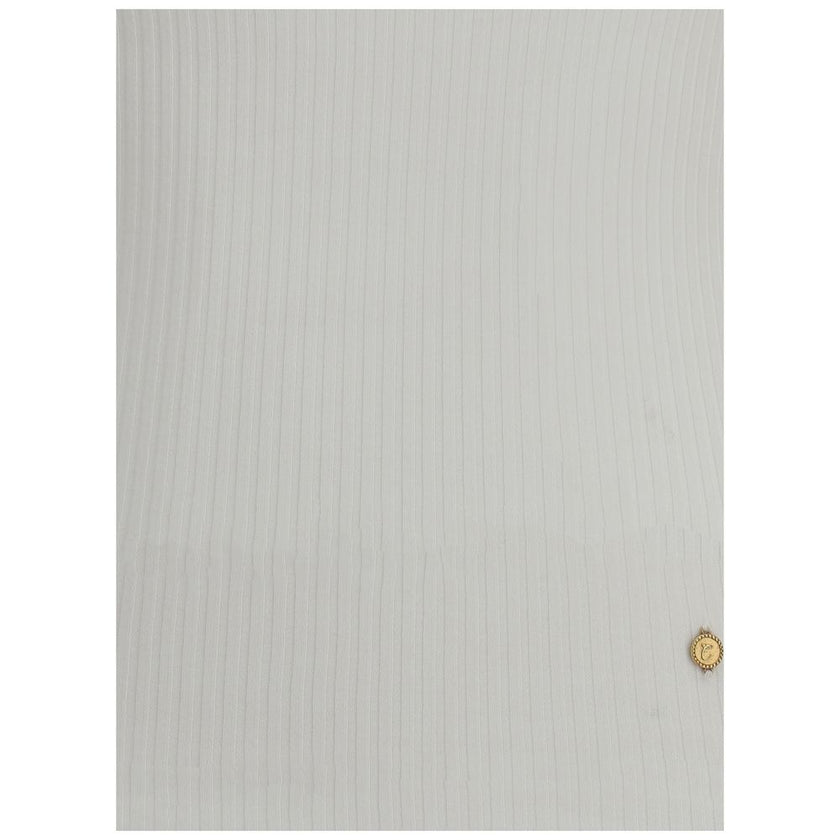 White Cotton TopThe Cotton Tank Top by Chloé channels feminine elegance through fluid and refined lines. Its lightweight silhouette is enhanced by tailored finishes and a golden medal detail on the side, a signature touch of the maison. With its essential