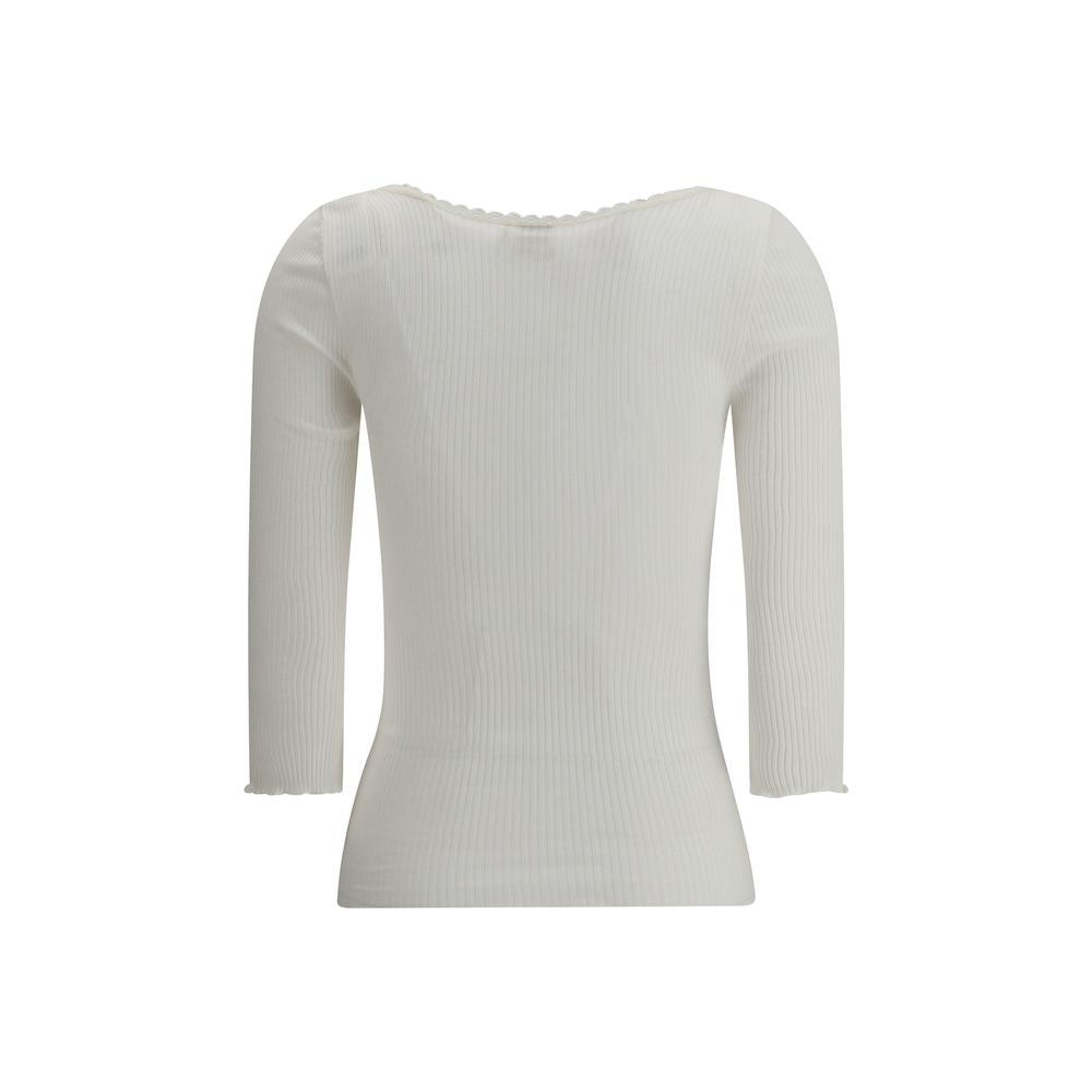 White Cotton CardiganThe Cotton Cardigan by Chloé embodies essential and timeless elegance. Featuring a round neckline, front button fastening and long sleeves, it stands out with its clean lines, straight hem and tonal stitching. A lightweight and refine