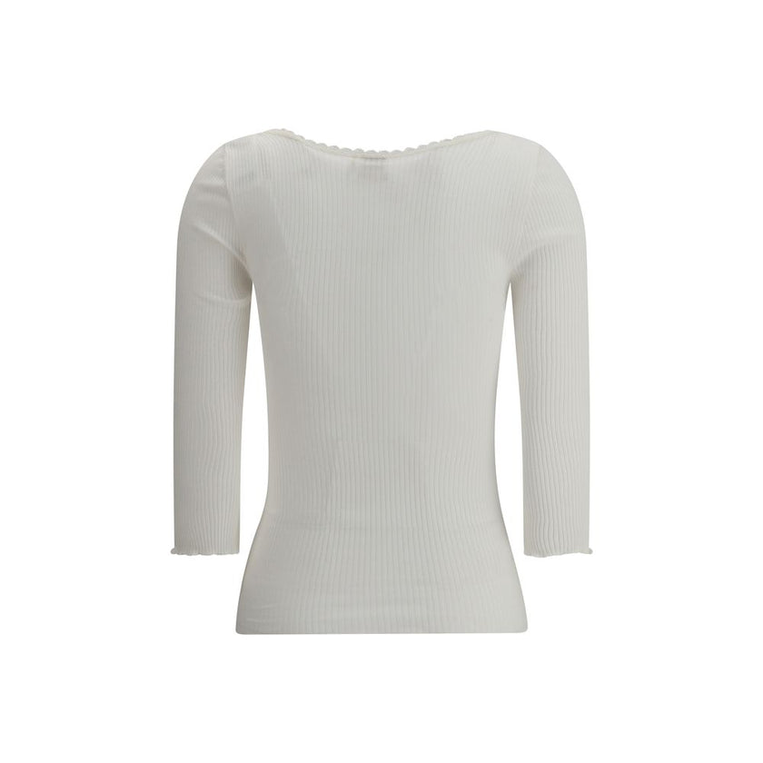 White Cotton CardiganThe Cotton Cardigan by Chloé embodies essential and timeless elegance. Featuring a round neckline, front button fastening and long sleeves, it stands out with its clean lines, straight hem and tonal stitching. A lightweight and refine