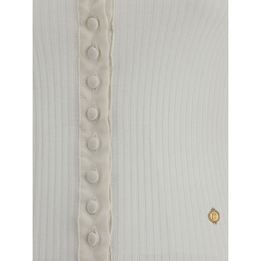 White Cotton CardiganThe Cotton Cardigan by Chloé embodies essential and timeless elegance. Featuring a round neckline, front button fastening and long sleeves, it stands out with its clean lines, straight hem and tonal stitching. A lightweight and refine