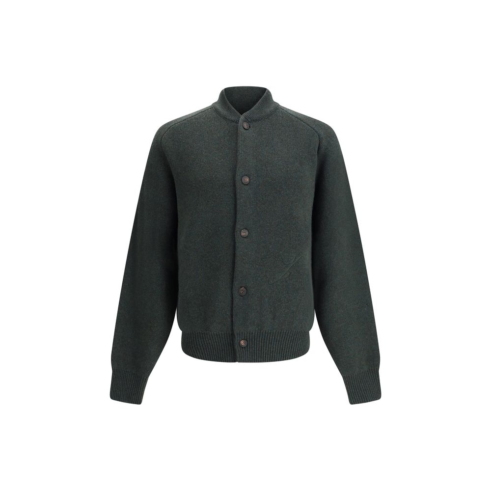 Embroidered Virgin Wool CardiganThe Virgin Wool Cardigan by Jacquemus combines elegance and comfort, featuring front buttons that emphasize its refined silhouette. The long sleeves and ribbed trims add a touch of classic style, while the embroidered detai