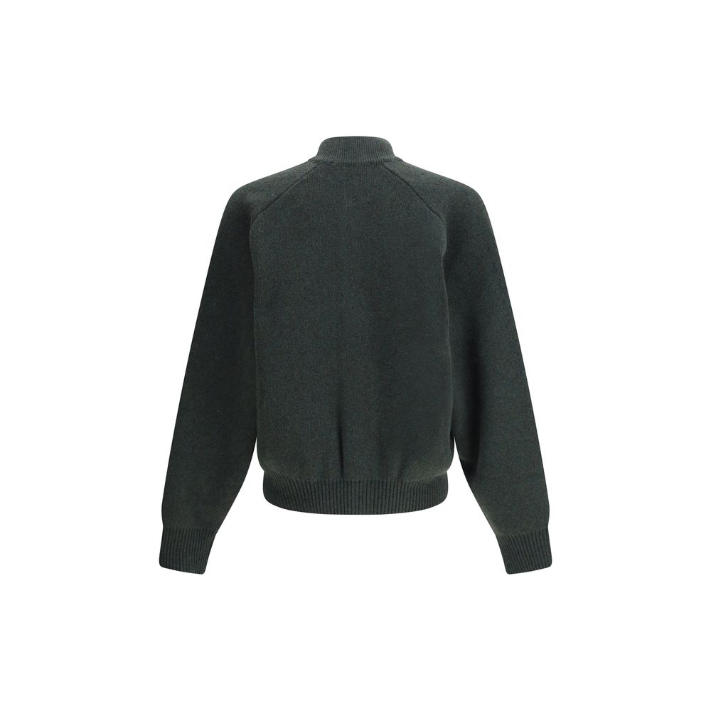 Embroidered Virgin Wool CardiganThe Virgin Wool Cardigan by Jacquemus combines elegance and comfort, featuring front buttons that emphasize its refined silhouette. The long sleeves and ribbed trims add a touch of classic style, while the embroidered detai