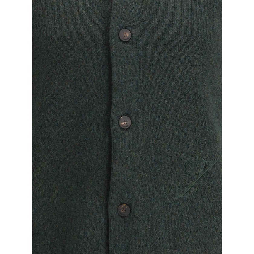 Embroidered Virgin Wool CardiganThe Virgin Wool Cardigan by Jacquemus combines elegance and comfort, featuring front buttons that emphasize its refined silhouette. The long sleeves and ribbed trims add a touch of classic style, while the embroidered detai