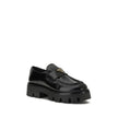 Black Calf Leather Bos Taurus Platform LoafersBrushed leather Monolith Loafers by Prada reinterpret a classic with a bold, contemporary twist. Featuring a leather horsebit upper with metallic detail, they have a burlotto bowl and an all-leather lining. Th