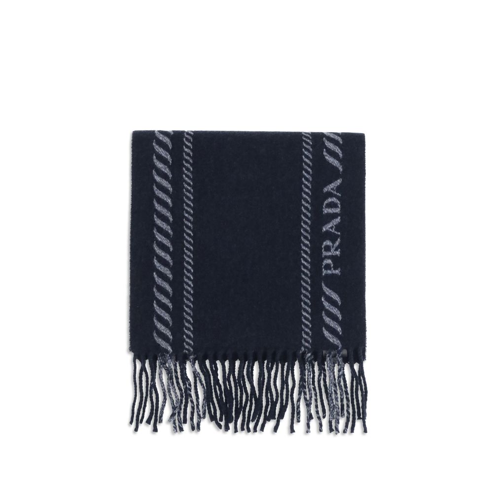 Blue Fleece Wool ScarfThe virgin wool and cashmere Scarf by Prada is an elegant and versatile accessory. Crafted from soft blue virgin wool and cashmere, it is enriched with a refined grey striped pattern and logo inlay along the edges. Fringed hems add a