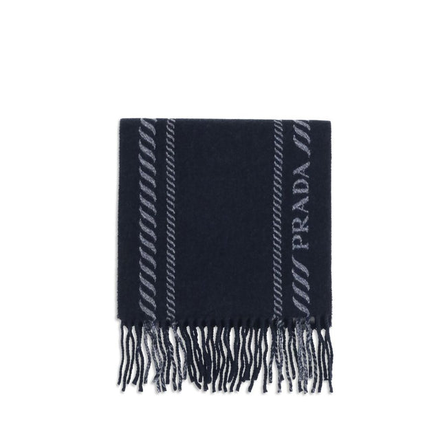 Blue Fleece Wool ScarfThe virgin wool and cashmere Scarf by Prada is an elegant and versatile accessory. Crafted from soft blue virgin wool and cashmere, it is enriched with a refined grey striped pattern and logo inlay along the edges. Fringed hems add a