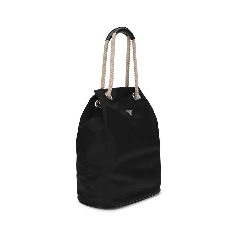Black Recycled Polyamide Shoulder BagMedium Mariner Re-Nylon Bucket Bag by Prada combines functional design and sustainable materials. The soft, roomy silhouette is enhanced by rope and leather sliding handles that contrast with the technical texture of R