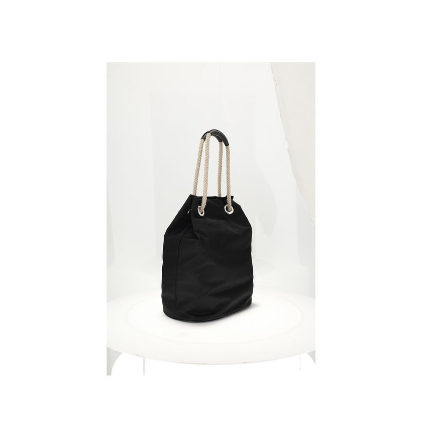 Black Recycled Polyamide Shoulder BagMedium Mariner Re-Nylon Bucket Bag by Prada combines functional design and sustainable materials. The soft, roomy silhouette is enhanced by rope and leather sliding handles that contrast with the technical texture of R