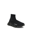 Black Rubber Athletic SneakersSpeed 2.0 Sneakers by Balenciaga feature a sock-like design with a sleek profile, elongated toe and ribbed ankle detail for a snug fit. The contrasting logo on the side and textured sole complete an urban, contemporary style