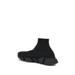 Black Rubber Athletic SneakersSpeed 2.0 Sneakers by Balenciaga feature a sock-like design with a sleek profile, elongated toe and ribbed ankle detail for a snug fit. The contrasting logo on the side and textured sole complete an urban, contemporary style