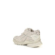 Beige Rubber Athletic SneakersThe Runner Sneakers by Balenciaga blend sportswear aesthetics with artisanal craftsmanship. Inspired by trekking and running shoes, they feature a layered, high-performance construction finished with a vintage wash that creat
