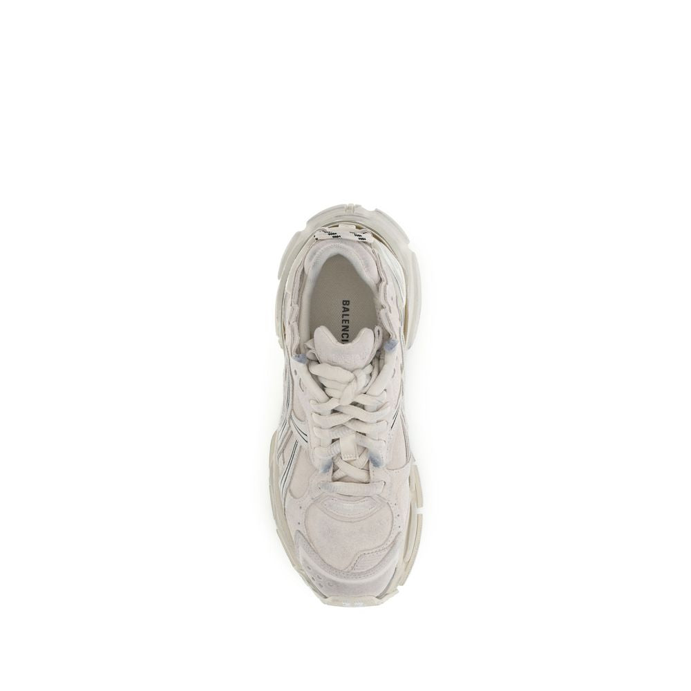 Beige Rubber Athletic SneakersThe Runner Sneakers by Balenciaga blend sportswear aesthetics with artisanal craftsmanship. Inspired by trekking and running shoes, they feature a layered, high-performance construction finished with a vintage wash that creat