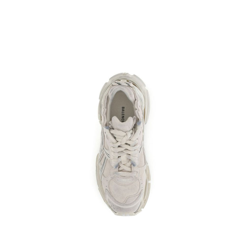 Beige Rubber Athletic SneakersThe Runner Sneakers by Balenciaga blend sportswear aesthetics with artisanal craftsmanship. Inspired by trekking and running shoes, they feature a layered, high-performance construction finished with a vintage wash that creat