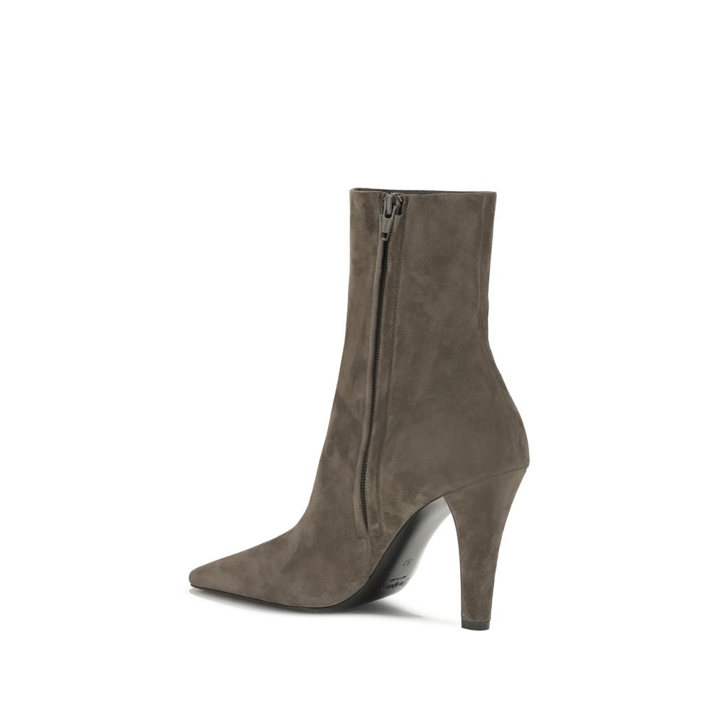 Jill suede Ankle BootsJill suede Ankle Boots by Saitn Laurent combine elegance and modernity with their square toe and wide tapered heel. The distinctive detail is the bronze metal Cassandre motif on the inside, while the side zipper closure ensures pract