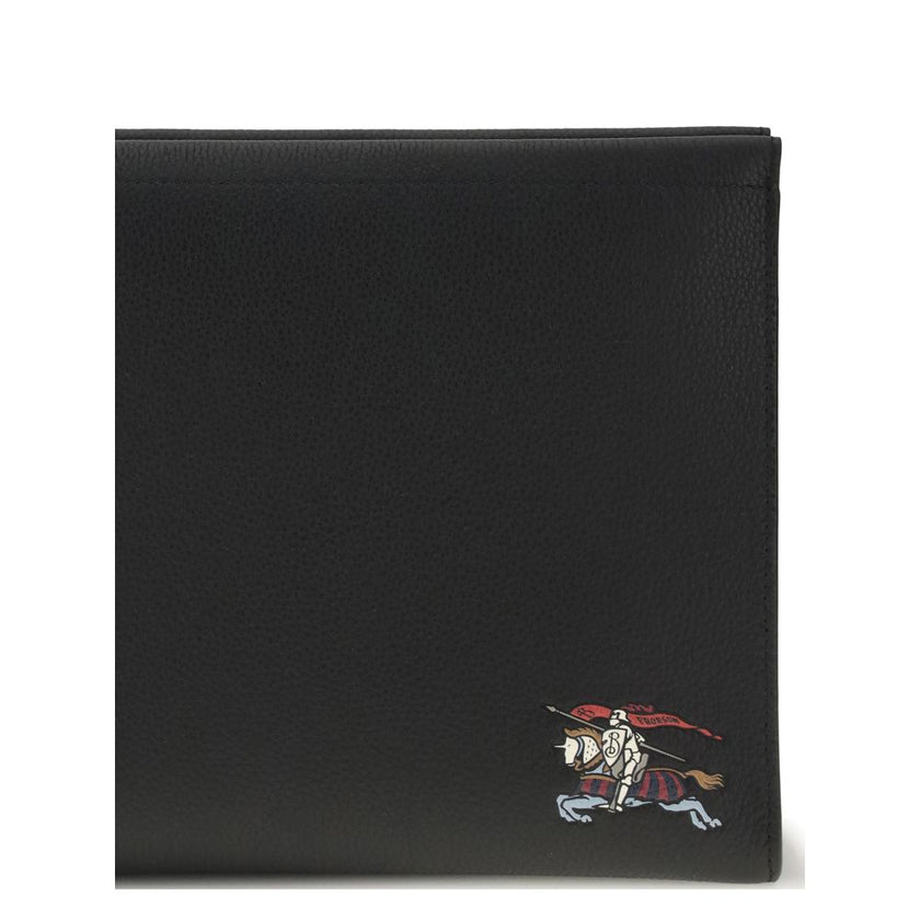 Leather PouchLeather Pouch by Burberry is a compact and stylish accessory embellished with the iconic multicolored Equestrian Knight embroidered on the front. Made of smooth leather, it features a concealed top zipper closure, ideal for storing essentials