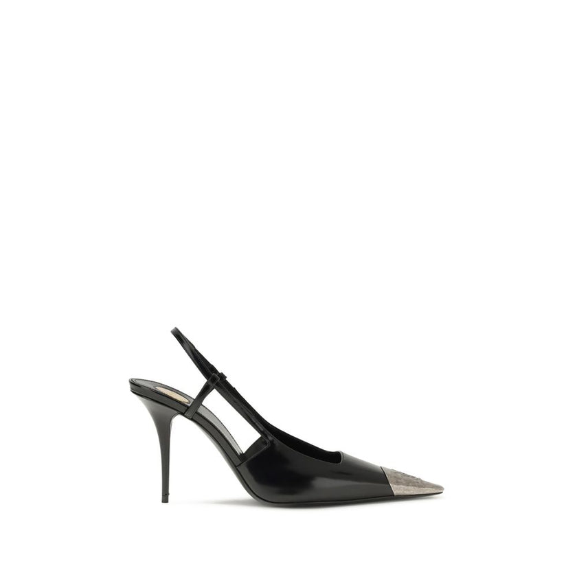 Black Calf Leather Bos Taurus PumpsJeanne Pumps by Saint Laurent are distinguished by a square metal toe decorated with a hammered Cassandre motif, which lends a bold and sophisticated touch. The opening at the back is enhanced by the elasticized strap, w