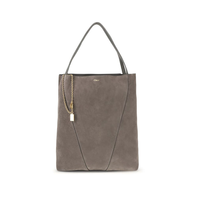 Gray Calf Leather Bos Taurus Shoulder BagThe Spin Tote Bag by Chloé embodies refined, timeless style. Crafted from soft suede calfskin with smooth leather trims, it features a clean, rectangular silhouette defined by minimalist lines. Dual top handles all