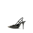 Black Calf Leather Bos Taurus PumpsJeanne Pumps by Saint Laurent are distinguished by a square metal toe decorated with a hammered Cassandre motif, which lends a bold and sophisticated touch. The opening at the back is enhanced by the elasticized strap, w