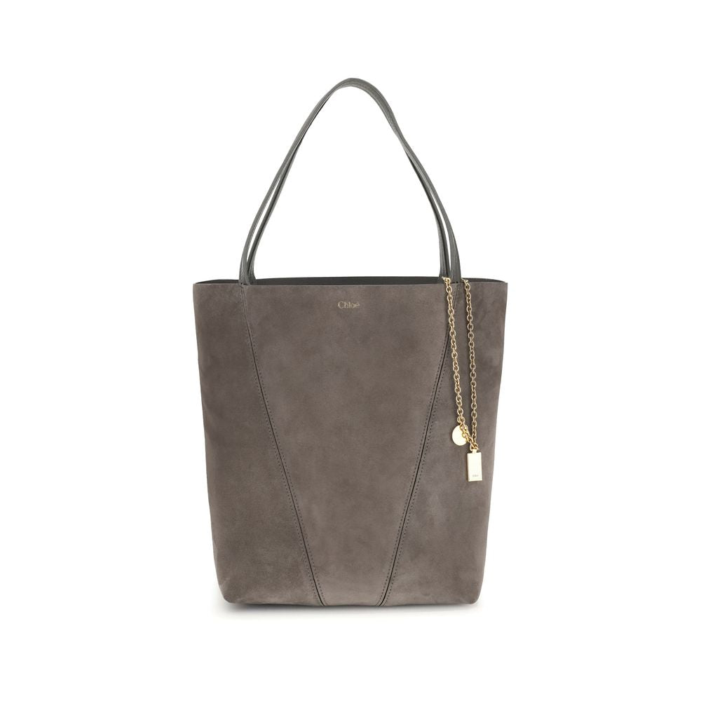 Gray Calf Leather Bos Taurus Shoulder BagThe Chloé Spin Tote Bag in suede combines a minimalist silhouette with iconic details. The two leather handles ensure practicality, while the pendant chain with the Chloé and Horse medals adds a distinctive touch.