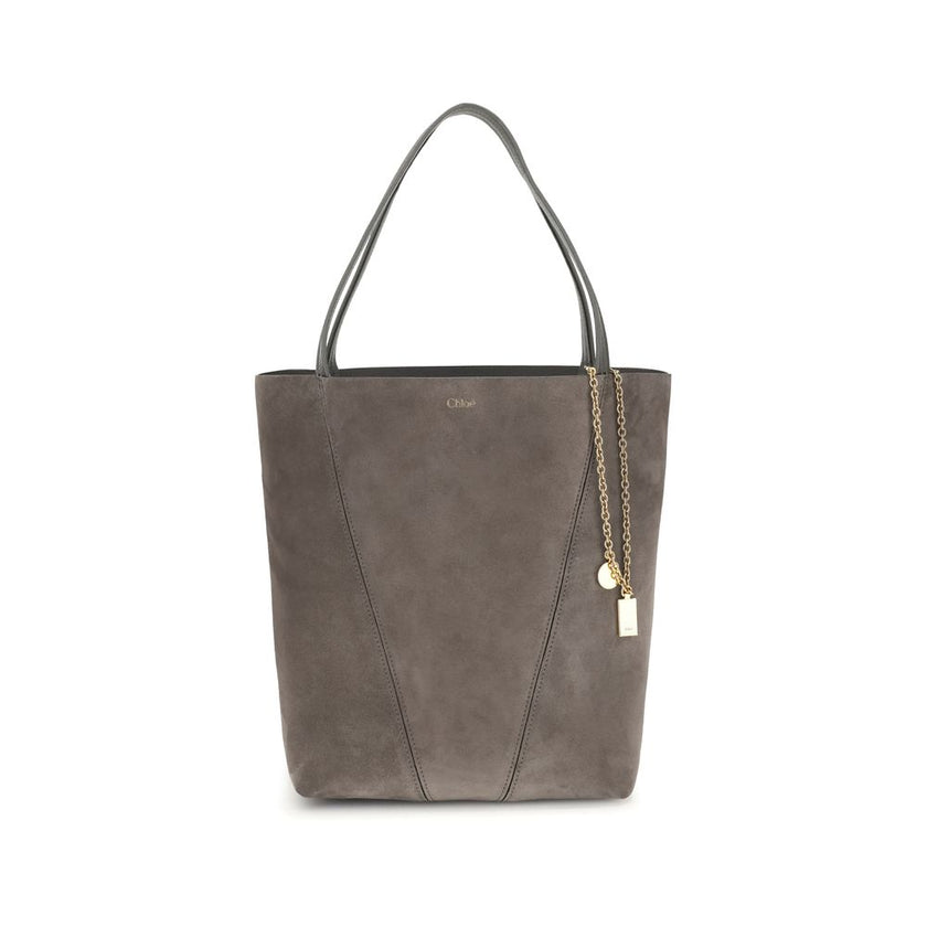 Gray Calf Leather Bos Taurus Shoulder BagThe Chloé Spin Tote Bag in suede combines a minimalist silhouette with iconic details. The two leather handles ensure practicality, while the pendant chain with the Chloé and Horse medals adds a distinctive touch.