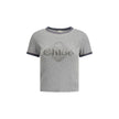 Gray Cotton ClothingThe Baby Fit Logo T-shirt by Chloé embodies the elegance of simplicity and the purity of clean lines. Crafted from soft organic cotton jersey, it offers a comfortable fit with an understated silhouette. A subtle embroidered detail at t