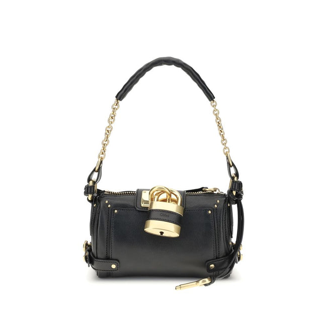 Paddington Shoulder BagPaddington Shoulder Bag by Chloé, crafted from soft garnet buffalo leather, stands out for its compact and flexible silhouette. Featuring a practical top zipper, it is embellished with iconic details such as an oversize padlock, C-s
