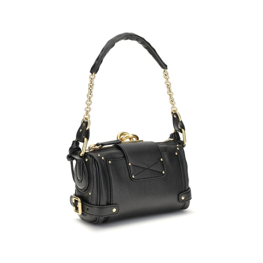 Paddington Shoulder BagPaddington Shoulder Bag by Chloé, crafted from soft garnet buffalo leather, stands out for its compact and flexible silhouette. Featuring a practical top zipper, it is embellished with iconic details such as an oversize padlock, C-s