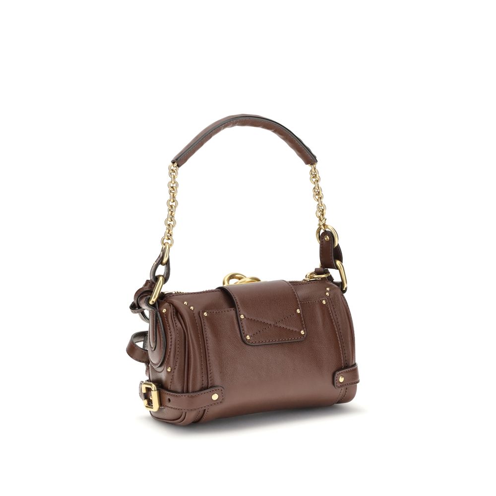 Paddington Shoulder BagPaddington Shoulder Bag by Chloé, crafted from soft garnet buffalo leather, stands out for its compact and flexible silhouette. Featuring a practical top zipper, it is embellished with iconic details such as an oversize padlock, C-s