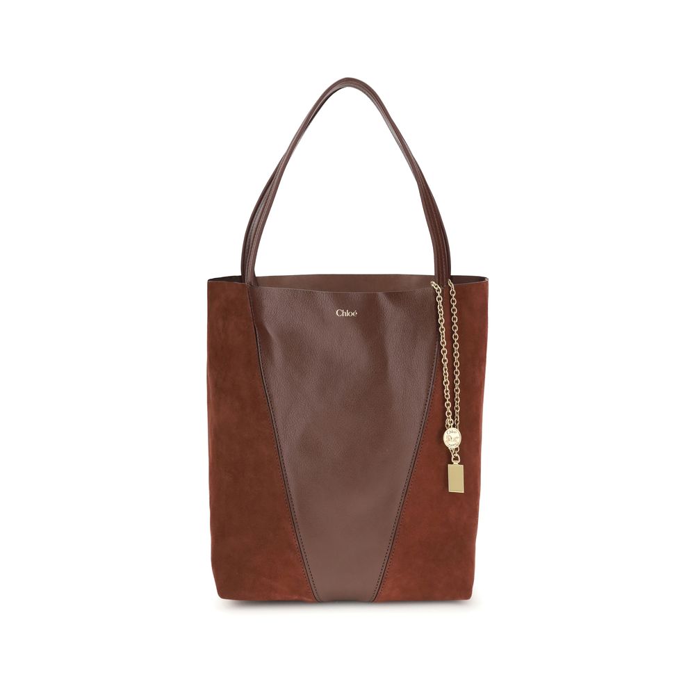 Brown Leather Shoulder BagThe Spin Shoulder Bag by Chloè captures the effortless elegance of the French Maison. Crafted from a refined combination of grained leather and suede, it features a subtle laminated logo on the front. Two flat leather handles enh