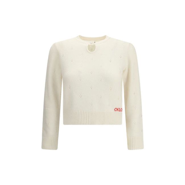 Cream Wool SweatshirtThe Jumper by Chloé blends lightness and refinement with an openwork motif that highlights its ethereal elegance. A buttoned keyhole neck brings a touch of femininity and sophistication, while ribbed trims softly define the silhouette