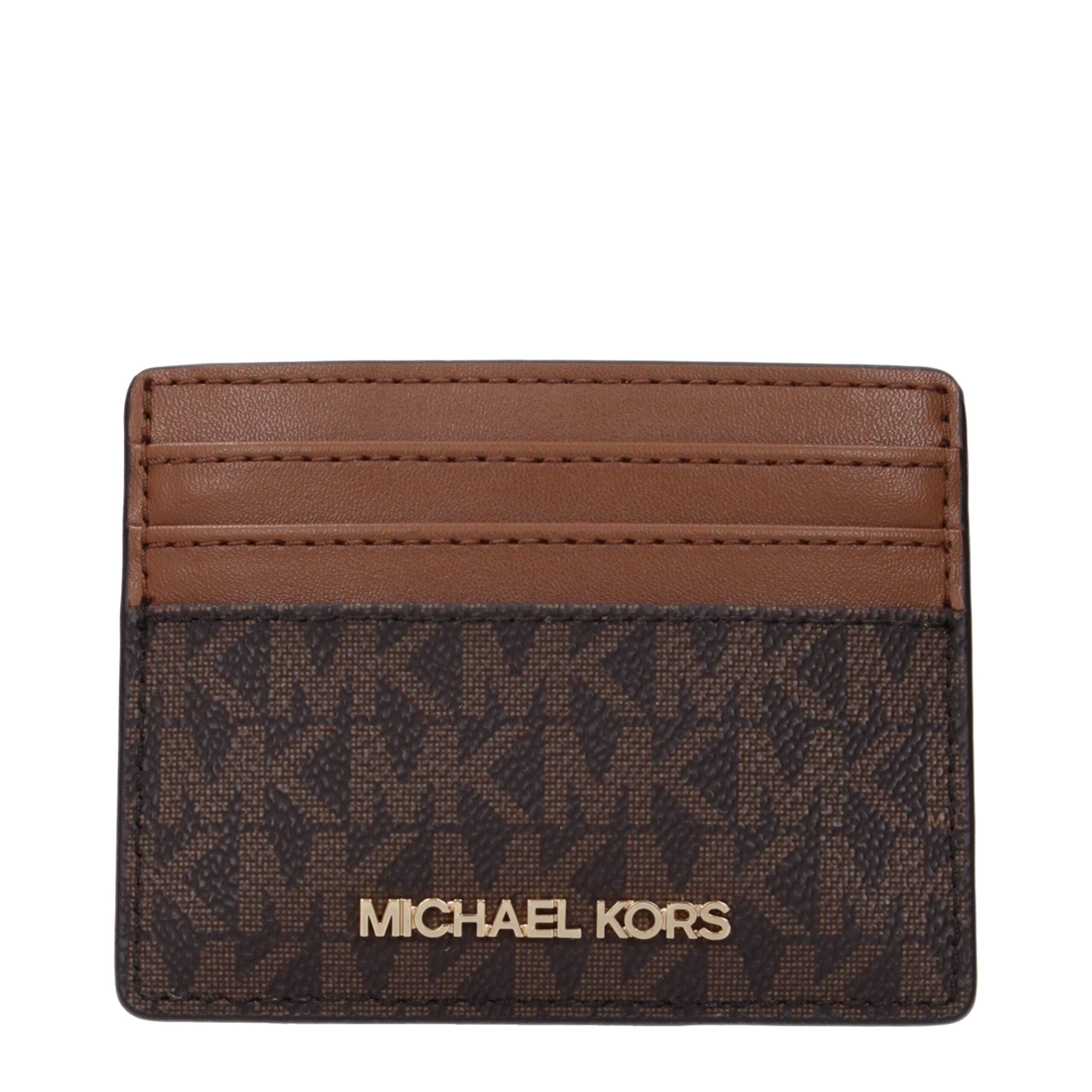 Brown Fabric CardholderDescription: The product with MPN 35F8GTVD3BBROWN and code F85045 fabric in brown is a document holders designed by Michael Kors. It has features like front logo.Brown Fabric Cardholder${tagsMichael KorsAulae Brown Fabric Cardholder