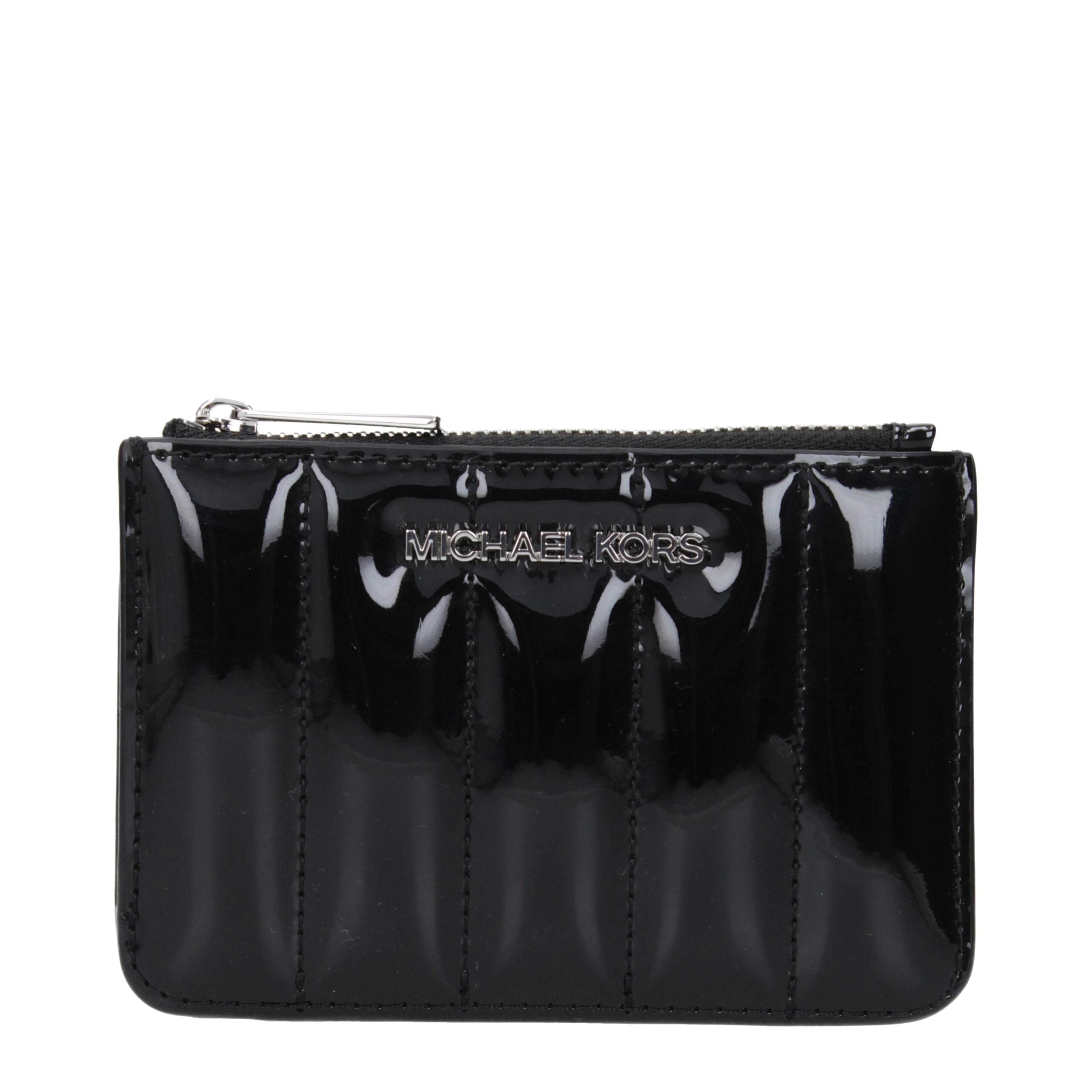 Black Leather WalletDescription: The product with MPN 35T5STVP1ABLACK and code F85050 patent leather in black is a coin purses designed by Michael Kors. It has features like front logo.Black Leather Wallet${tagsMichael KorsAulae Black Leather Wallet Micha