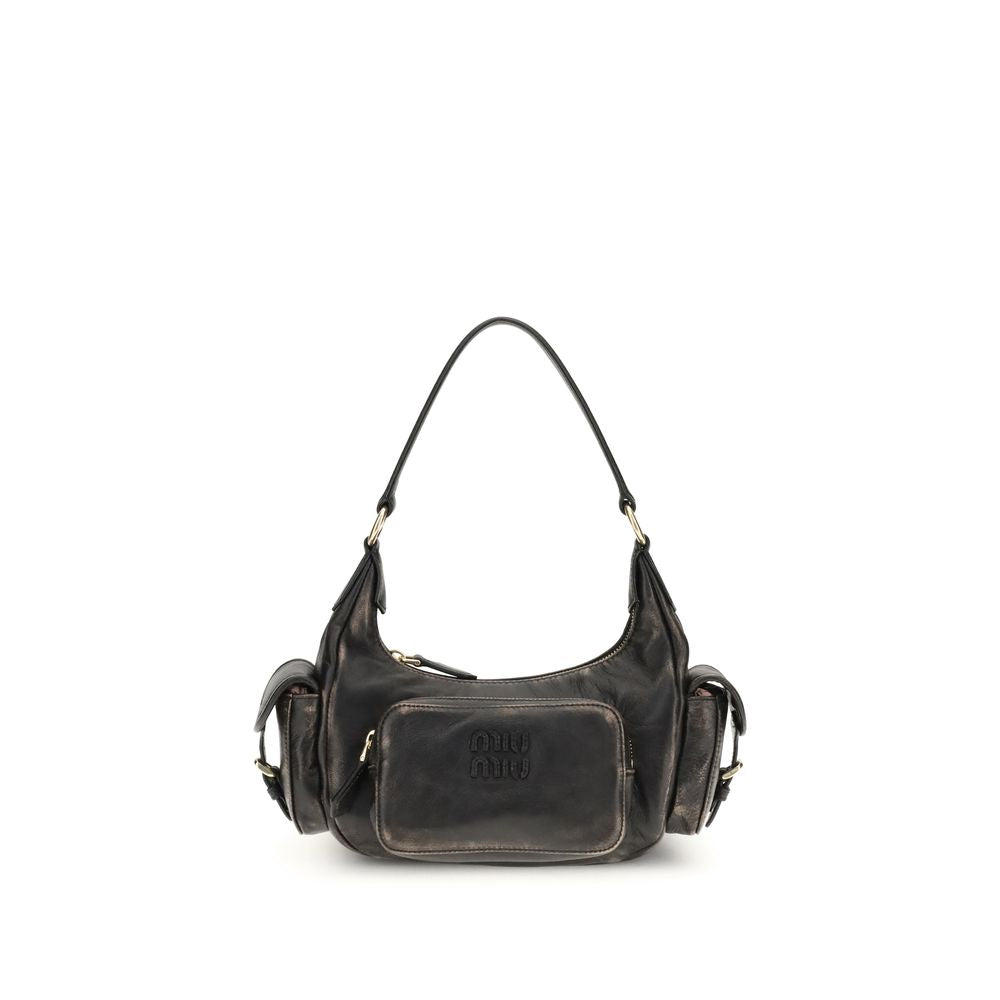 Pocket Shoulder BagThe Pocket Shoulder Bag in nappa leather by Miu Miu combines contemporary design with practical functionality thanks to its numerous pockets. Crafted from nappa leather with a distressed finish, it is enriched with leather details, gold