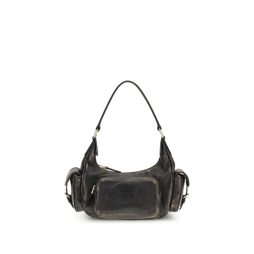 Pocket Shoulder BagThe Pocket Shoulder Bag in nappa leather by Miu Miu combines contemporary design with practical functionality thanks to its numerous pockets. Crafted from nappa leather with a distressed finish, it is enriched with leather details, gold