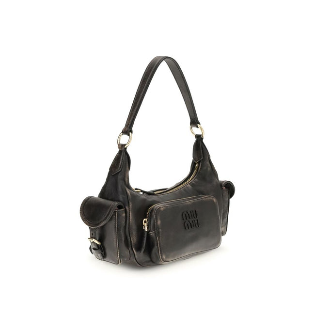 Pocket Shoulder BagThe Pocket Shoulder Bag in nappa leather by Miu Miu combines contemporary design with practical functionality thanks to its numerous pockets. Crafted from nappa leather with a distressed finish, it is enriched with leather details, gold