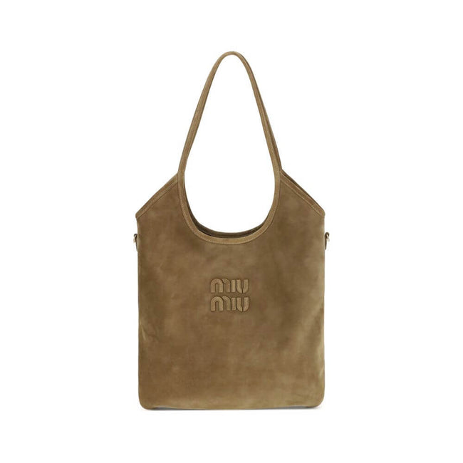 Ivy Shoulder BagThe Ivy Shoulder Bag by Miu Miu combines elegance and practicality in a sophisticated design. Featuring soft suede handles and gold hardware, it’s embellished with a leather logo lettering on the front. The cotton-lined interior includes a