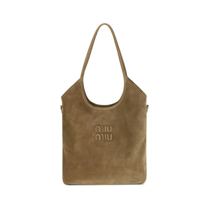 Ivy Shoulder BagThe Ivy Shoulder Bag by Miu Miu combines elegance and practicality in a sophisticated design. Featuring soft suede handles and gold hardware, it’s embellished with a leather logo lettering on the front. The cotton-lined interior includes a