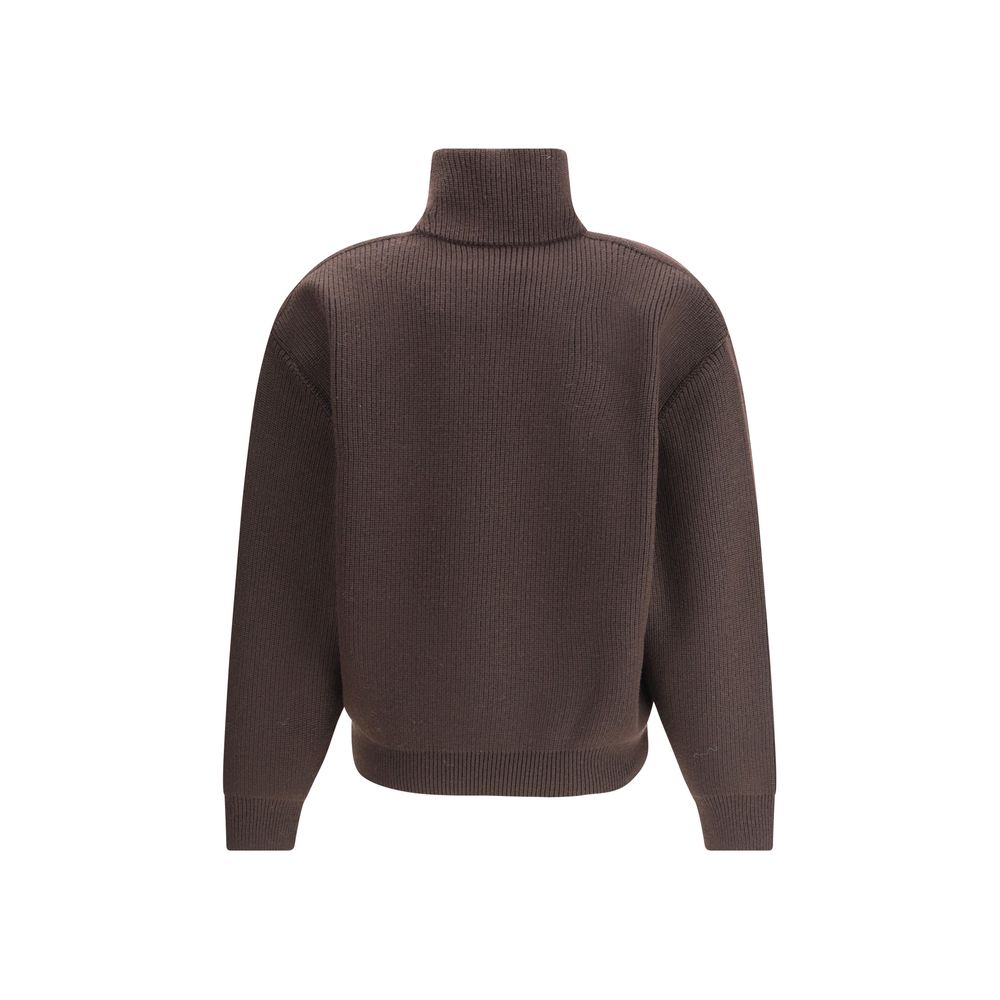 Brown Lamb Leather SweatshirtThe chunky Wool Knit Pullover by Yves Saint Laurent embodies the essence of tailored knitwear with a bold and refined character. Made from certified wool, it features a stand-up collar and oversized structured shoulders, givin
