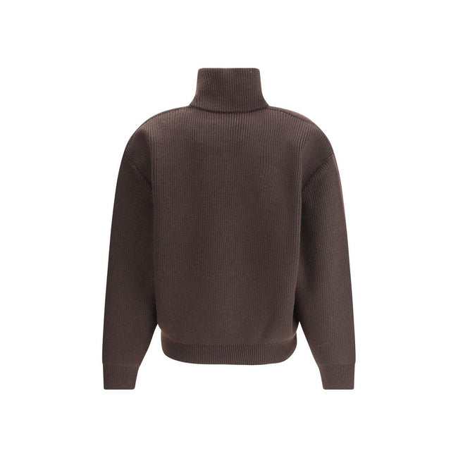 Brown Lamb Leather SweatshirtThe chunky Wool Knit Pullover by Yves Saint Laurent embodies the essence of tailored knitwear with a bold and refined character. Made from certified wool, it features a stand-up collar and oversized structured shoulders, givin