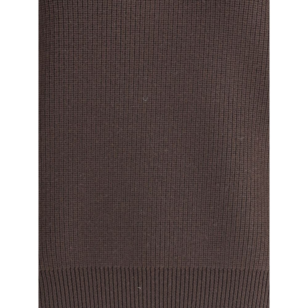 Brown Lamb Leather SweatshirtThe chunky Wool Knit Pullover by Yves Saint Laurent embodies the essence of tailored knitwear with a bold and refined character. Made from certified wool, it features a stand-up collar and oversized structured shoulders, givin