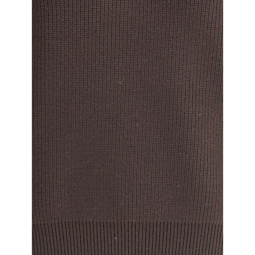 Brown Lamb Leather SweatshirtThe chunky Wool Knit Pullover by Yves Saint Laurent embodies the essence of tailored knitwear with a bold and refined character. Made from certified wool, it features a stand-up collar and oversized structured shoulders, givin