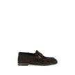 Le Loafer LoafersThe Le Loafer Loafers by Saint Laurent are crafted from soft suede and stand out for their hand-stitched moc toe and iconic gold-tone CASSANDRE decoration. Elegant and refined, they feature a leather sole that highlights their artisanal q